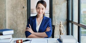 Attorney sitting at her desk - Above The Bar - Above The Bar Attorney sitting at her desk - Attorney sitting at her desk - Above The Bar - Attorney sitting at her desk - Above The Bar